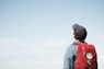man staring at white sky taken at daytime