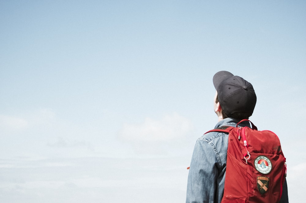 man staring at white sky taken at daytime