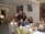 A joyful gathering of church members sharing a meal.