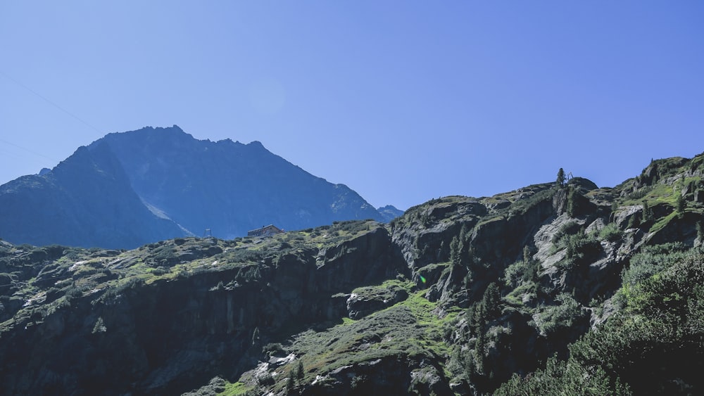 green and black mountains under blue sky during daytime