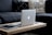 A sleek laptop displayed on a stylish table with accessories around it.