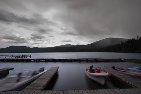 white boat near wooden dock over water in Odell Lake United States