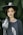woman standing near trees wearing black hat