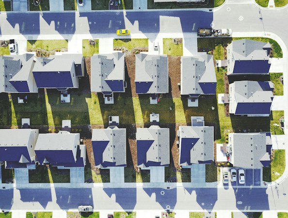 Overhead view of a master planned residential community with curving streets, parks and open space
