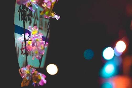 Surreal poster design with floating pixelated cherry blossoms over an enchanted park backdrop.