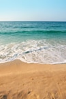 seashore under clear blue sky during daytime