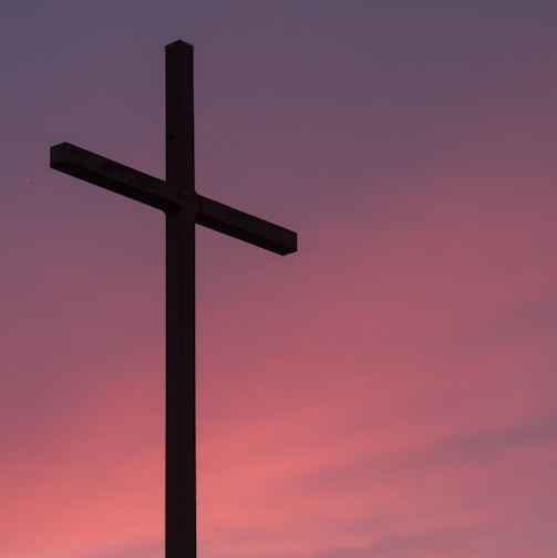 brown wooden cross during golden hour