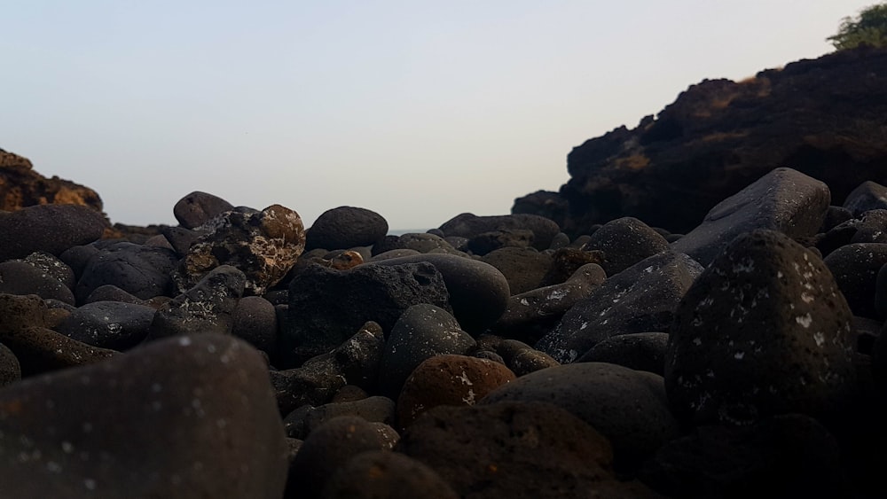 brown stone formation under cloudy sky