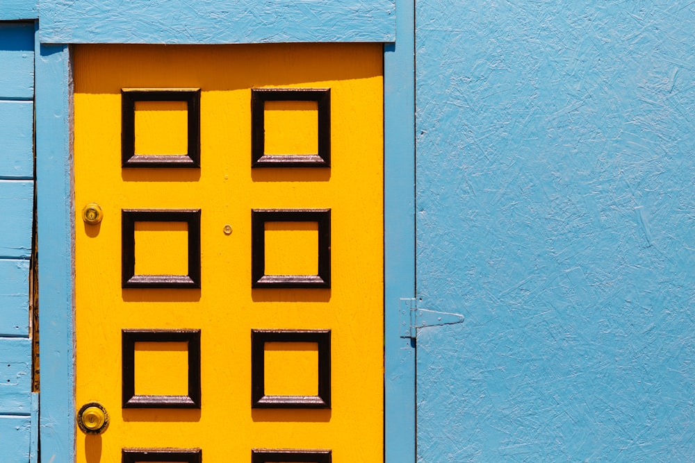 blue and yellow wooden door