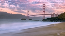 wide angle photo of Golden Gate Bridge under cloudy sky