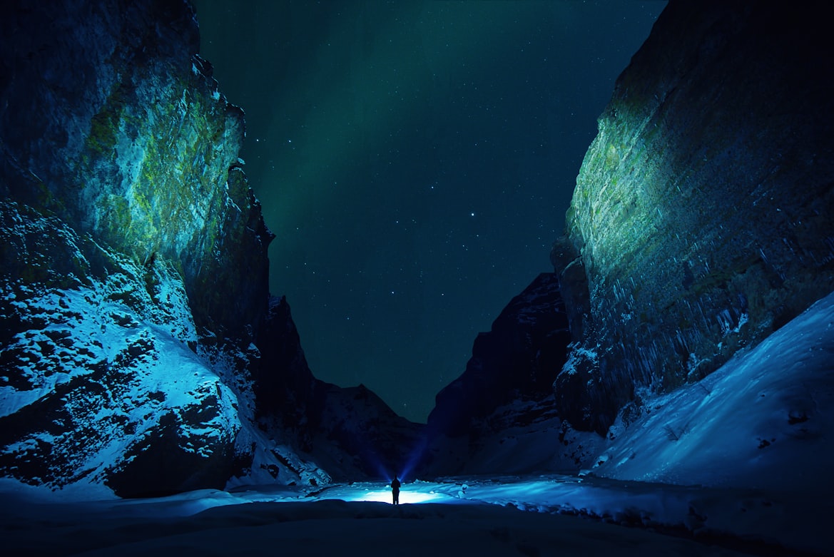 Strolling down the canyon. It was midnight and auroras were bursting, but i was stuck in the canyon, so i tried to make as much use as i can from the position where i was. The idea fell on my mind to light the sides with the torches and another selfie came out :)