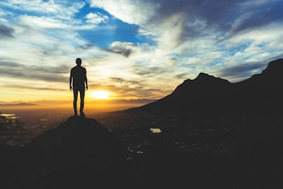 person standing at the top of mountain silhouette google meet background