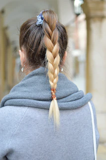 A sleek ponytail extension styled for a modern, chic look in the boutique’s private studio.