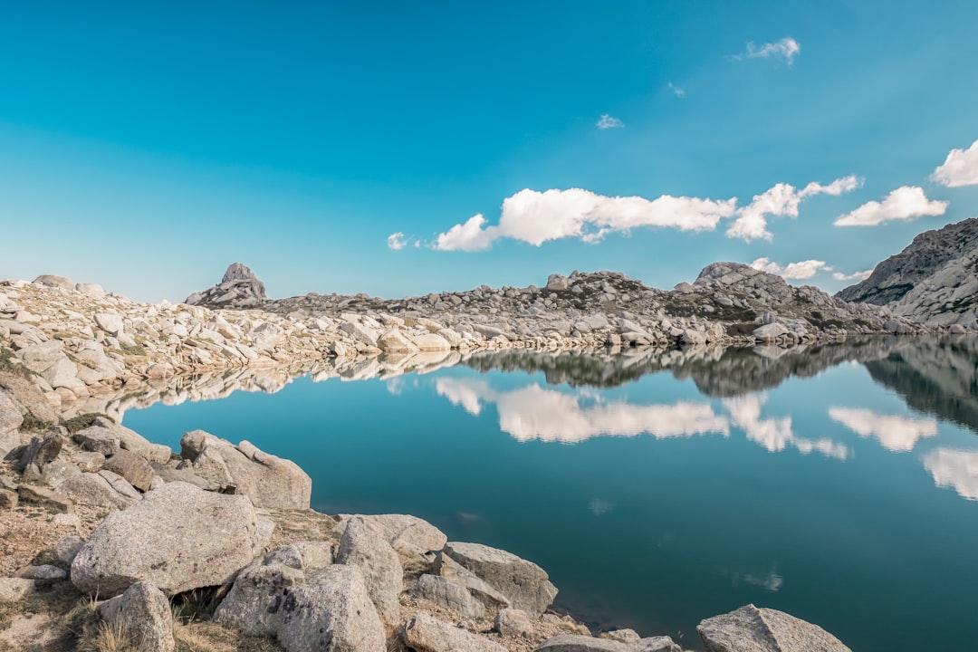 body of water surrounded by rock