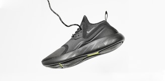 unpaired gray Nike running shoe