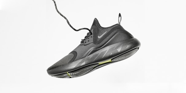 unpaired gray Nike running shoe