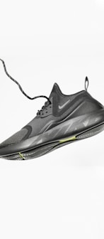 unpaired gray Nike running shoe