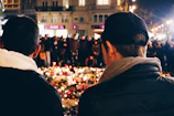 A nighttime candlelight vigil held by the community honoring peace and hope.
