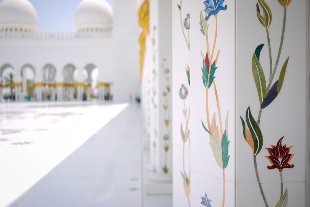 white floral pillar of white concrete building