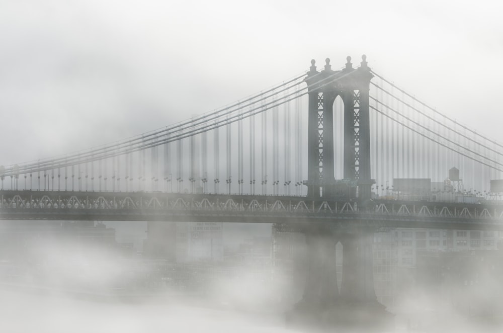 fog over Brooklyn Bridge during daytime