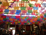 A vibrant display of papel picado designs showcasing traditional Mexican motifs.