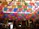 A vibrant display of colorful papel picado hanging in a cozy home celebration.