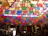 A vibrant display of colorful papel picado hanging in a cozy home celebration.