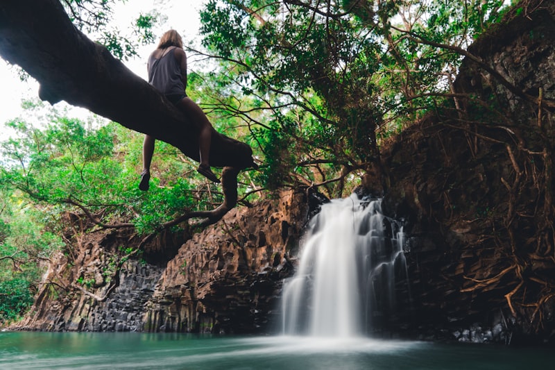 Road to Hana waterfall surrounded by tropical greenery in Maui