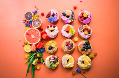 assorted flavor donuts with berries on top dessert google meet background