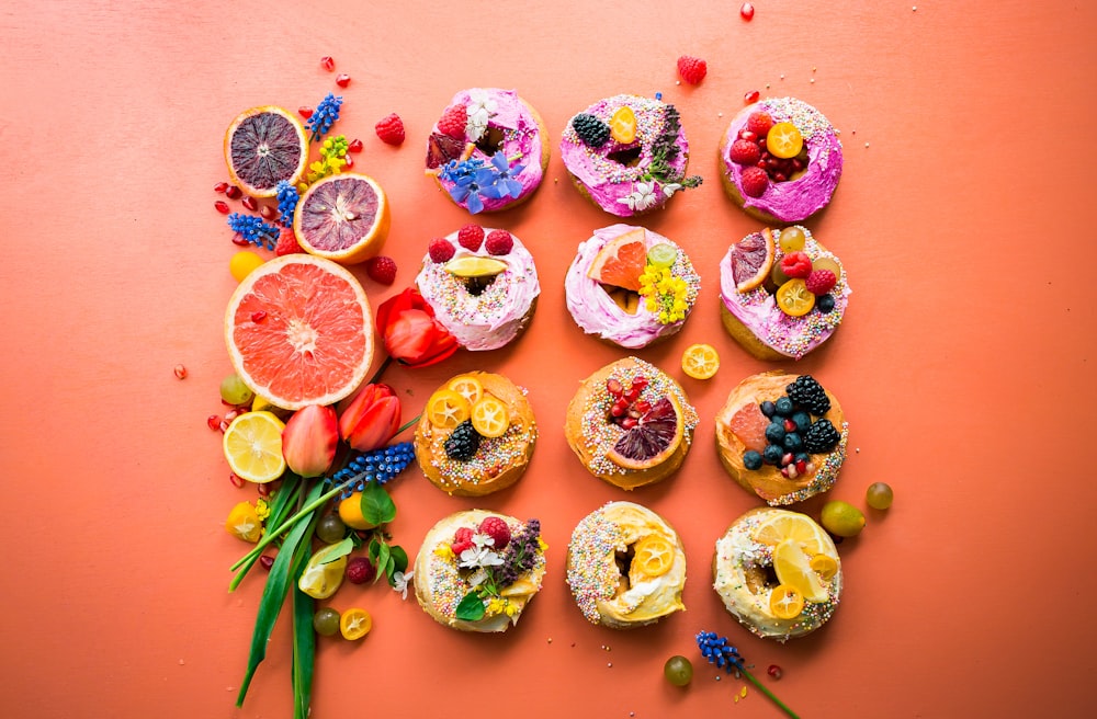 assorted flavor donuts with berries on top