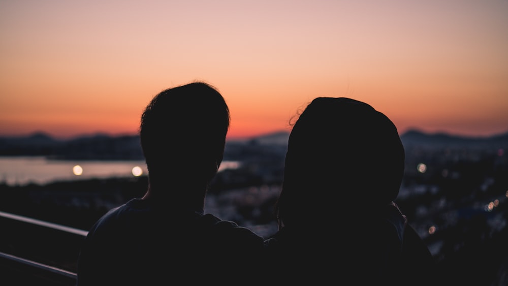 silhouette of two person