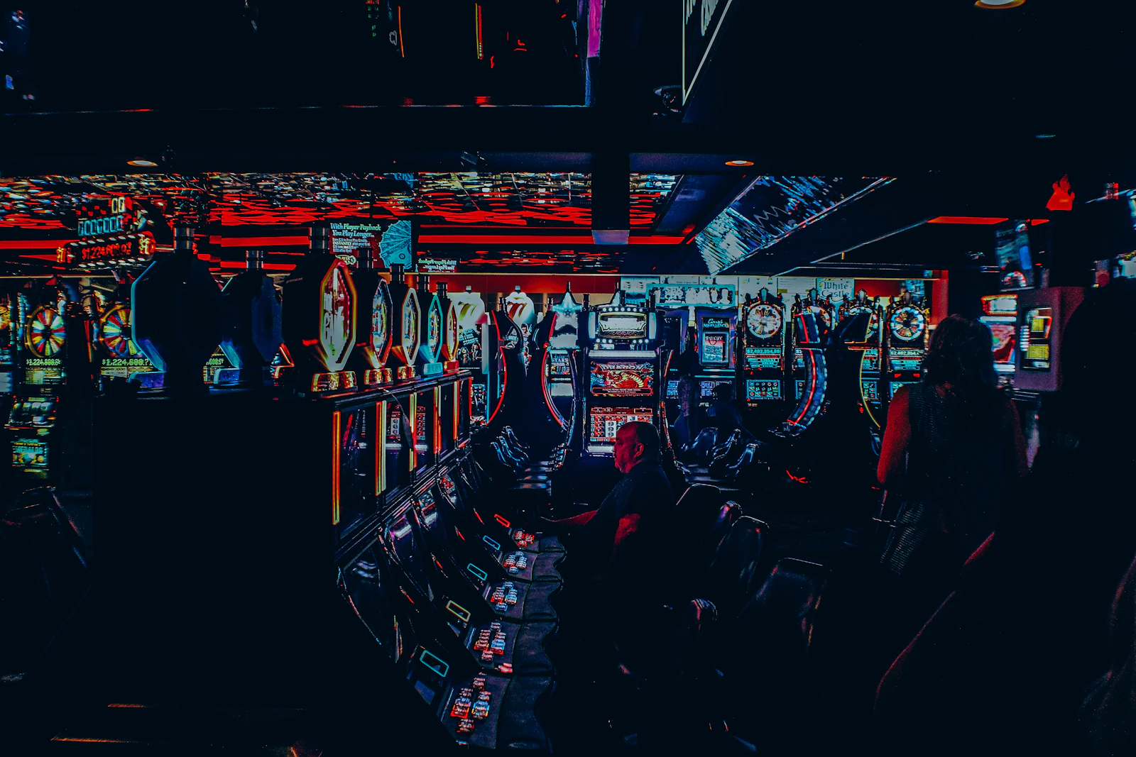 A casino floor lit in shifting color.