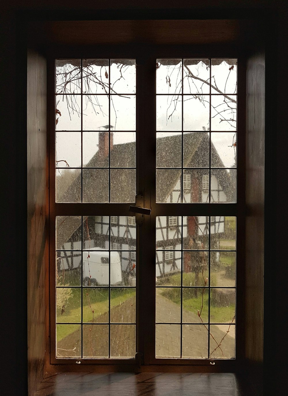 clear glass doors with brown frame inside brown room during daytime