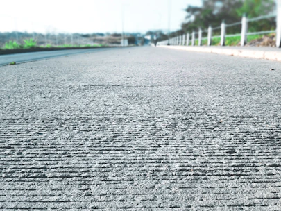 Wide shot of a large HGV road with freshly poured and brushed concrete surface.