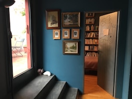 Freshly painted interior wall with cyan blue accents in a cozy room.