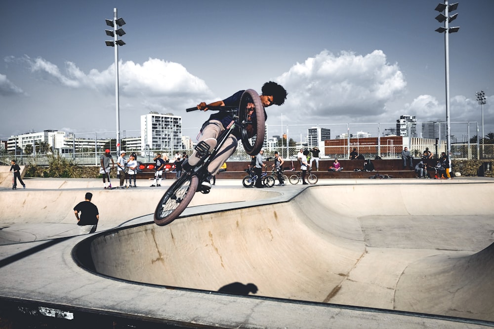 man in black and gray bike