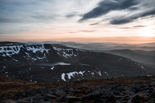 mountain under white and blue cloud sky in Lochnagar United Kingdom