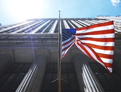 us flag waving on pole patriots teams background