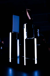 A sleek, modern construction site at dusk with steel beams and glowing blue accents.