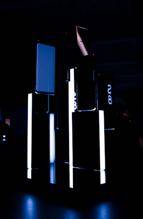 A sleek, modern construction site at dusk with steel beams and glowing blue accents.