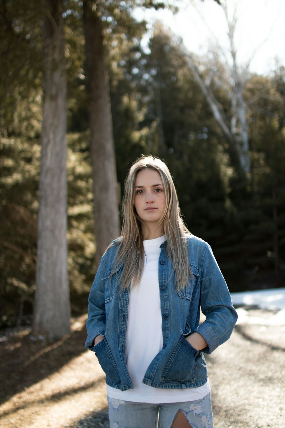 woman in blue denim button-up jacket