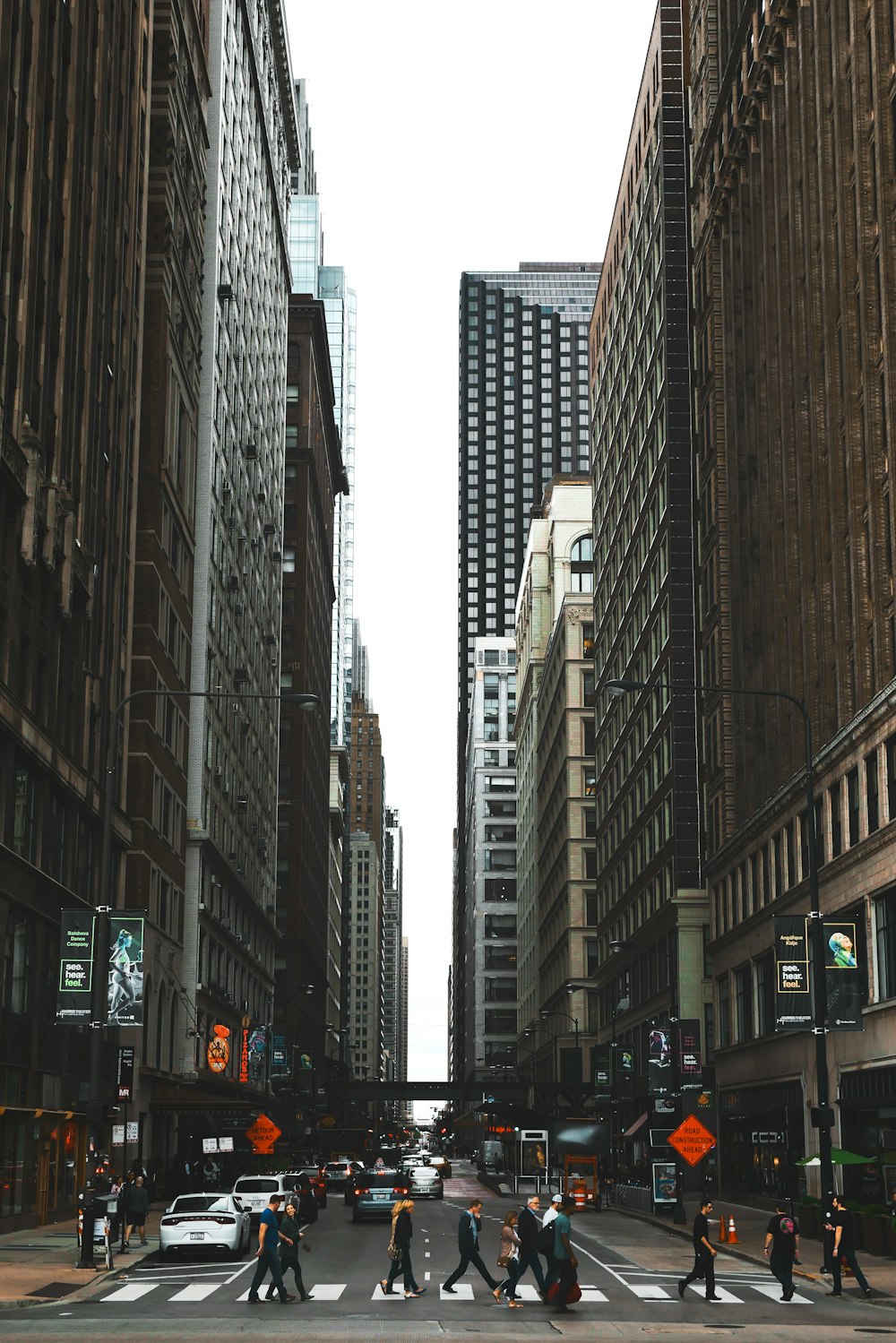 people crossing road during daytime