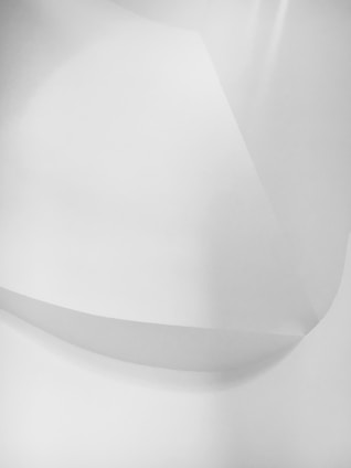 Abstract geometric shapes in neutral tones representing connection and flow.