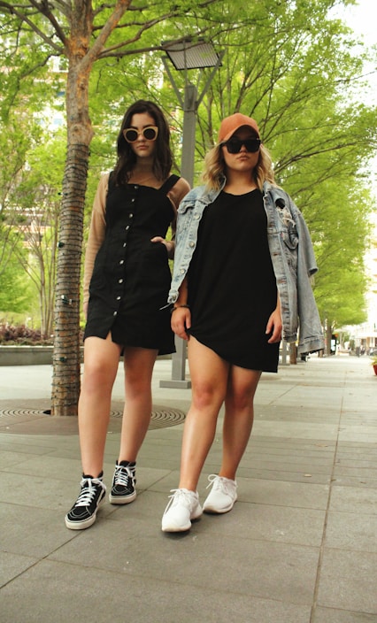 Modern women wearing stylish clothing and accessories outdoors