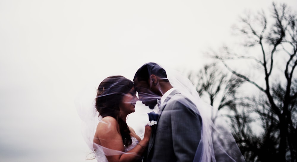 bride and groom facing each each other photo