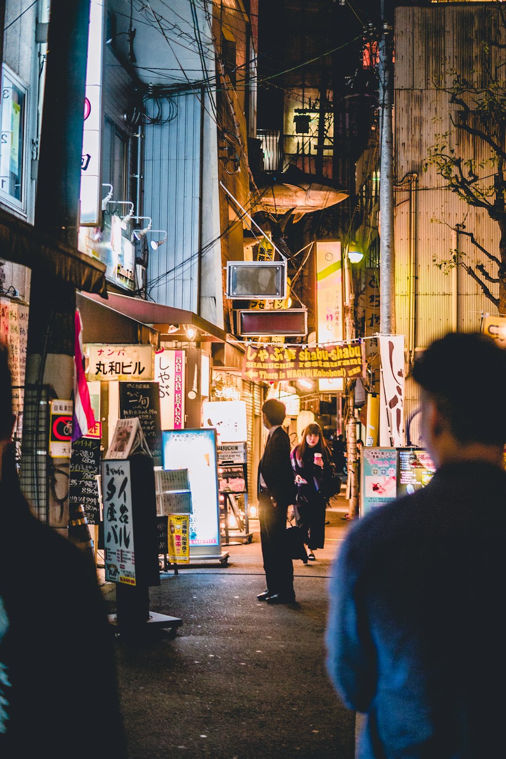 people walking beside building