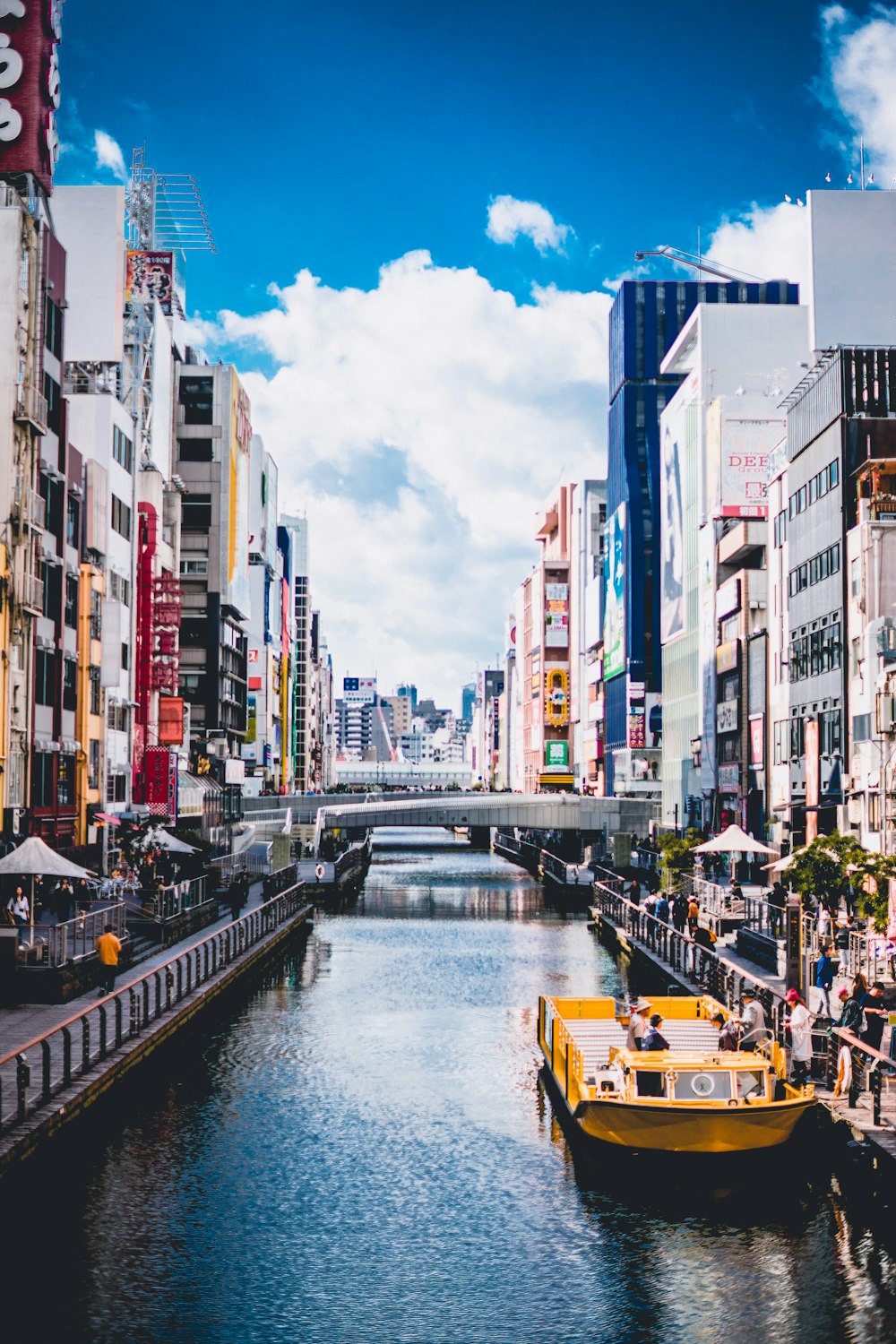 water between concrete buildings during daytime photo