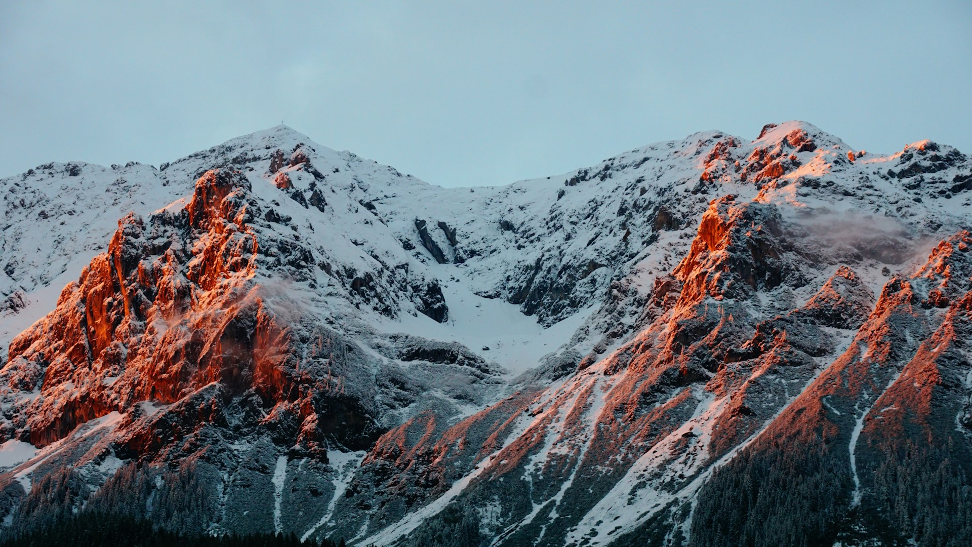photo of mountain covered of snow during cloudy sky