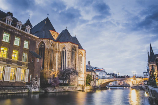 A warm, inviting photo of the Goulburn Revival Fellowship church building at 34 River Street, bathed in soft morning light.