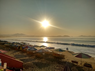 A scenic view of a sunrise workout session on the beach.
